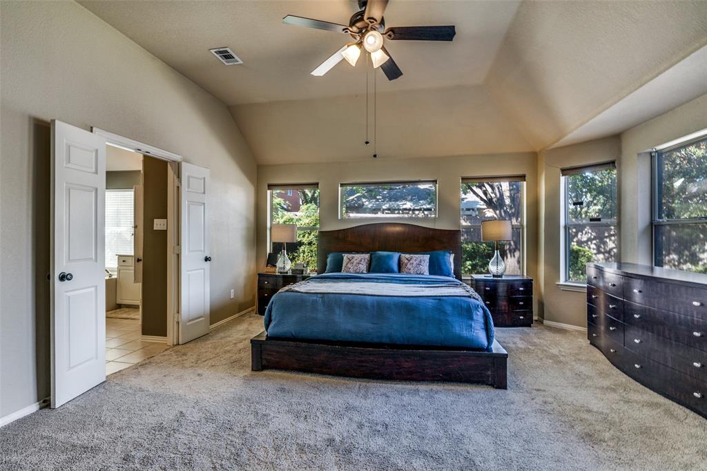 4317 Founders Drive Rowlett, TX 75089 - Photo 14 of 25 a spacious bedroom with a bed and large windows