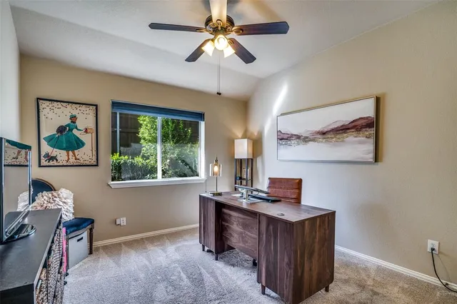 a workspace with furniture and a window