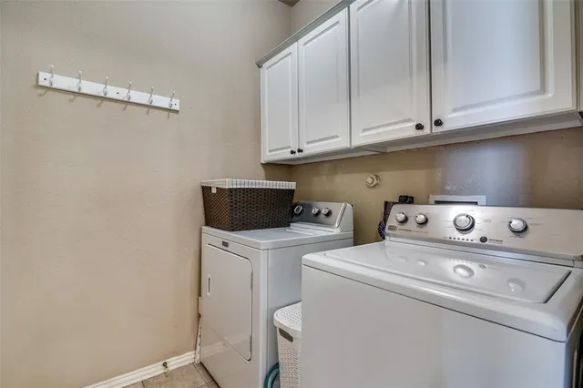 a view of storage and utility room with washer and dryer
