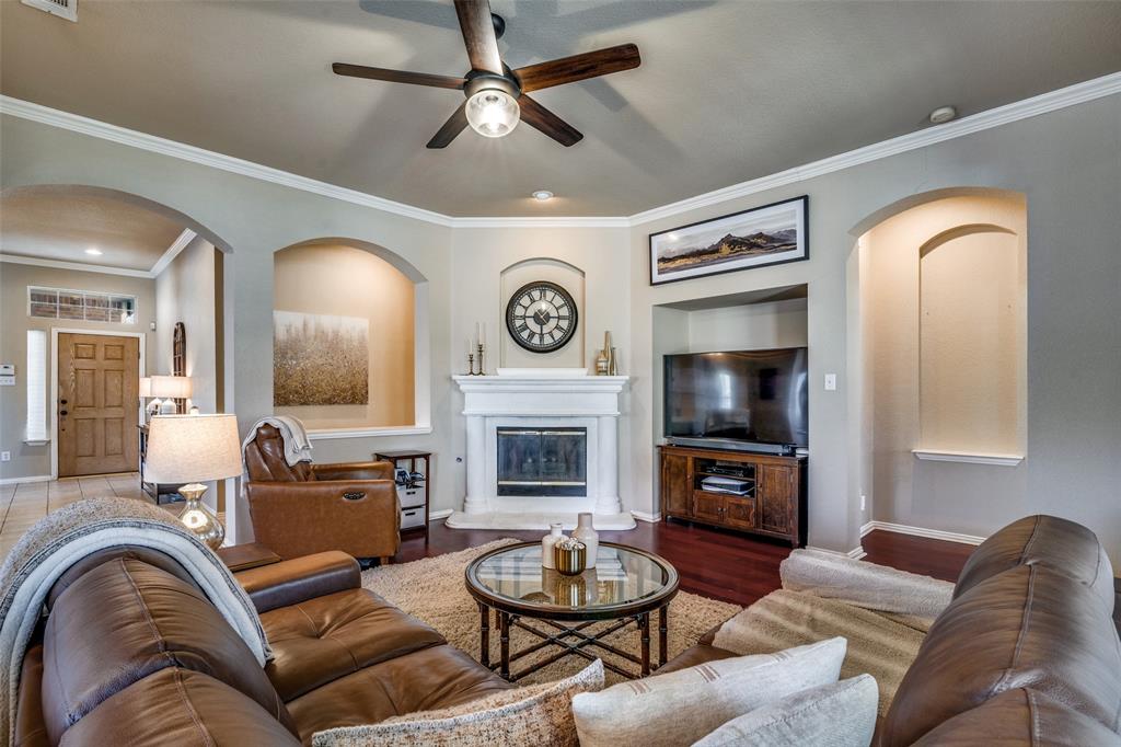 4317 Founders Drive Rowlett, TX 75089 - Photo 9 of 25 a living room with furniture fireplace and a mirror