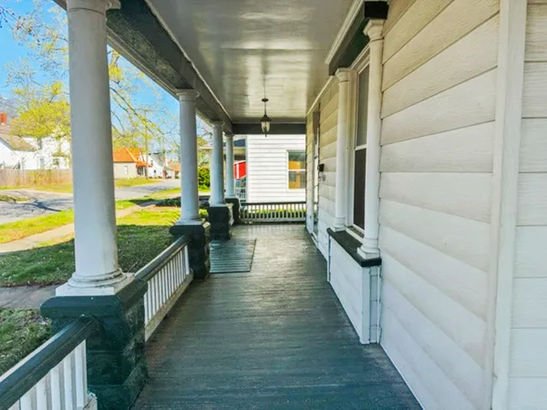 a view of a balcony with chairs