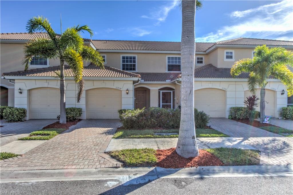 11719 Eros Road Lehigh Acres, FL 33971 - Photo 20 of 20 a front view of a house with garden