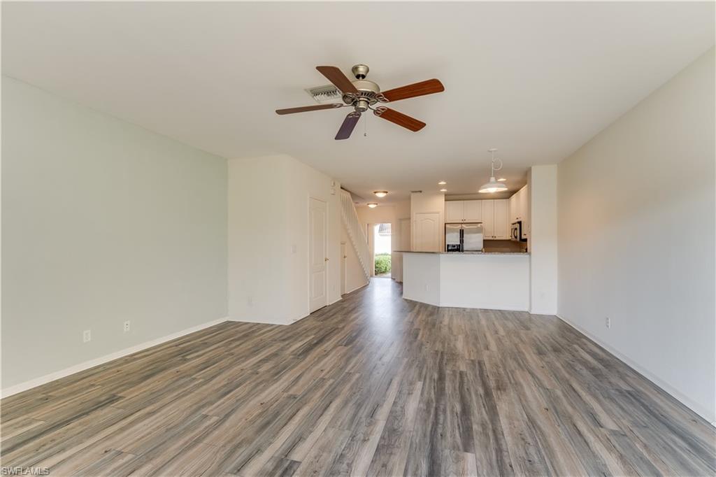 11719 Eros Road Lehigh Acres, FL 33971 - Photo 4 of 20 a view of empty room with wooden floor and window