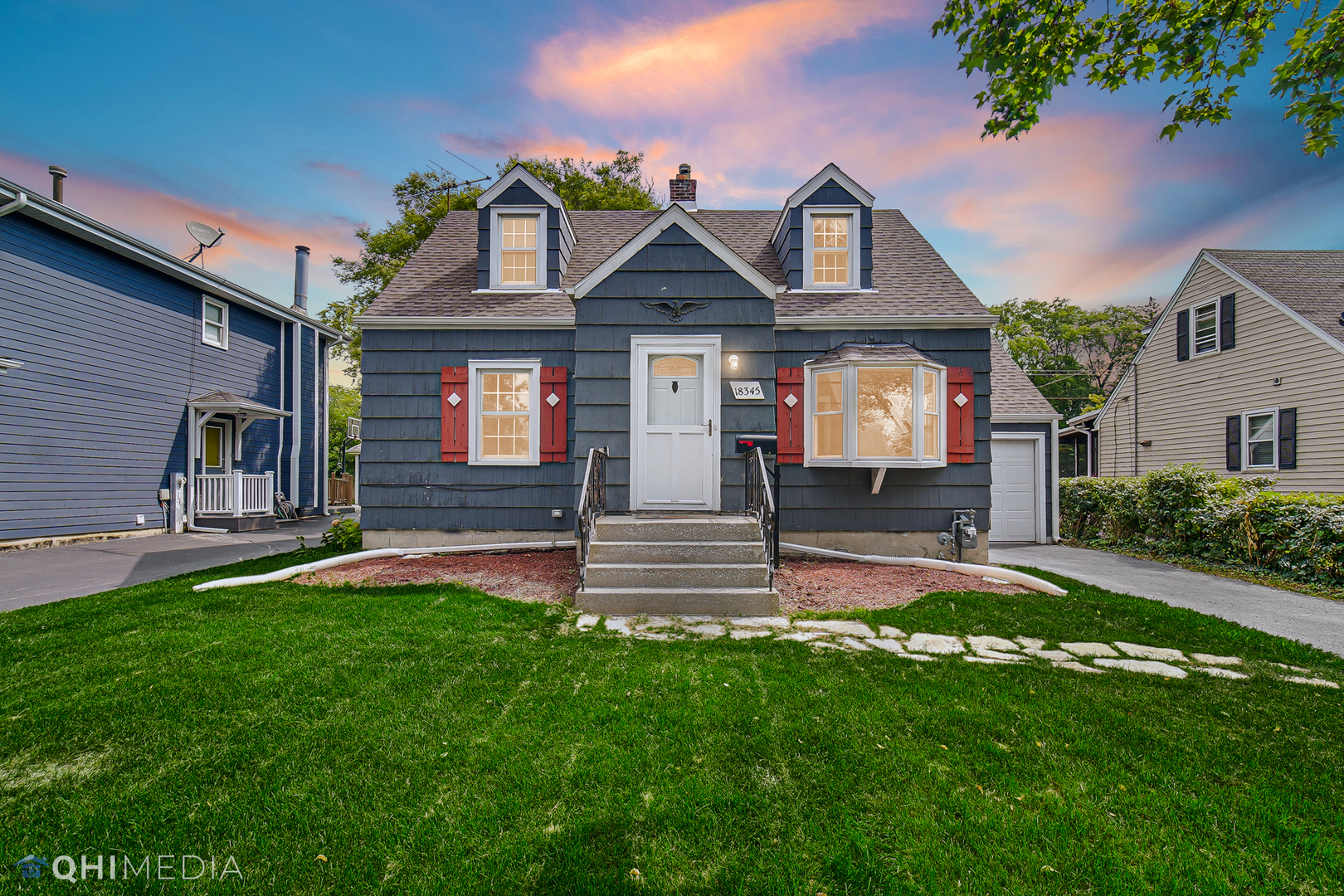 18345 Perth Avenue Homewood, IL 60430 - Photo 1 of 22 a front view of a house with a yard