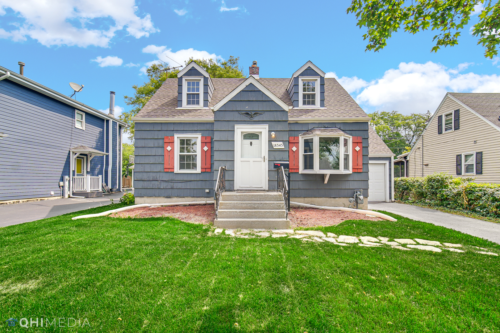 18345 Perth Avenue Homewood, IL 60430 - Photo 2 of 22 a front view of a house with a yard