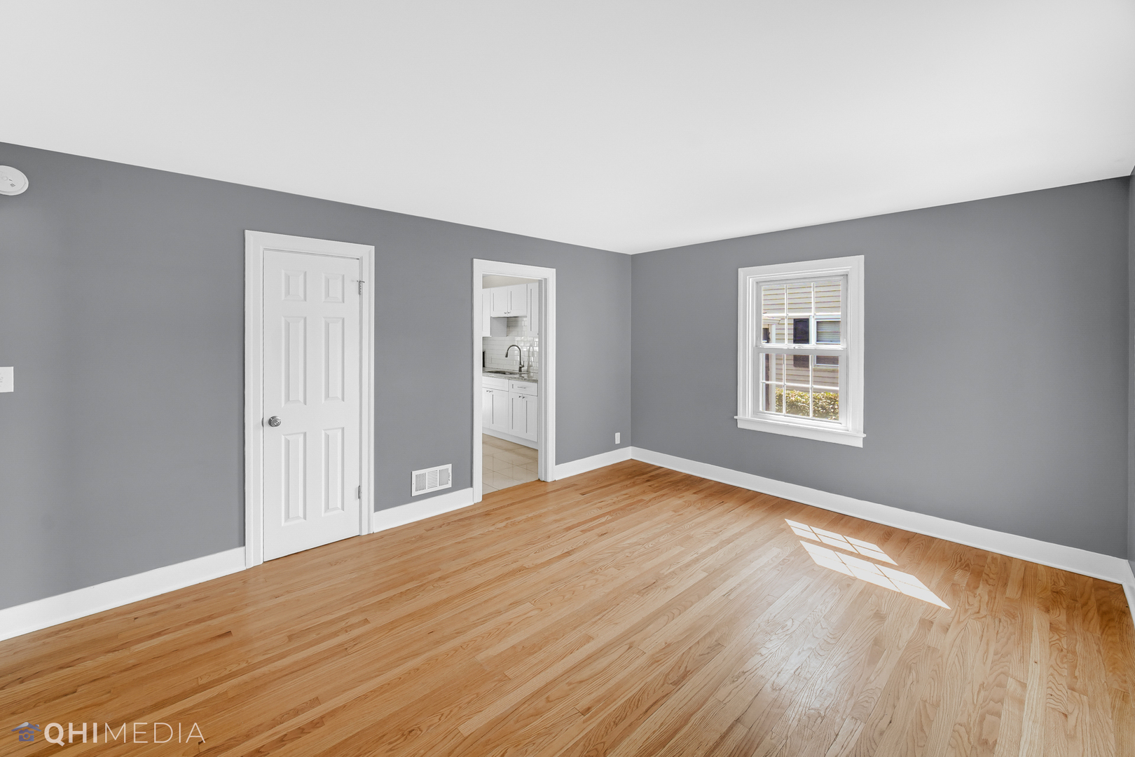 18345 Perth Avenue Homewood, IL 60430 - Photo 6 of 22 a view of empty room with wooden floor and fan