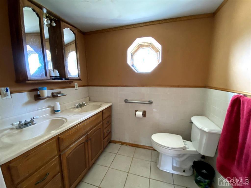 200 North Pemberton Road Pemberton, NJ 08068 - Photo 14 of 27 a bathroom with a toilet a sink and a mirror