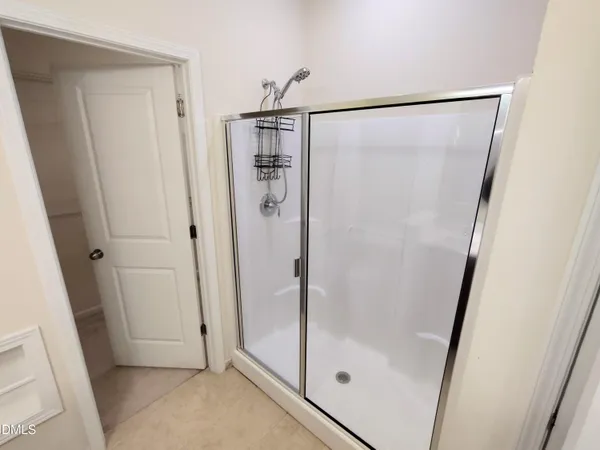a bathroom with a sink vanity and mirror
