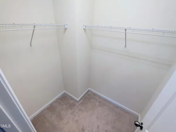 a white toilet sitting next to a bath tub