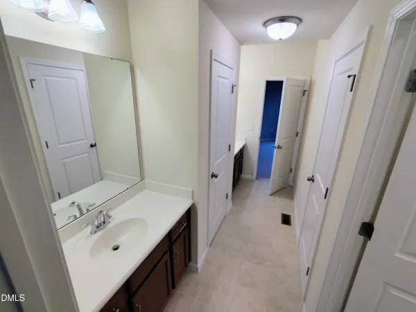 a white toilet sitting next to a bath tub