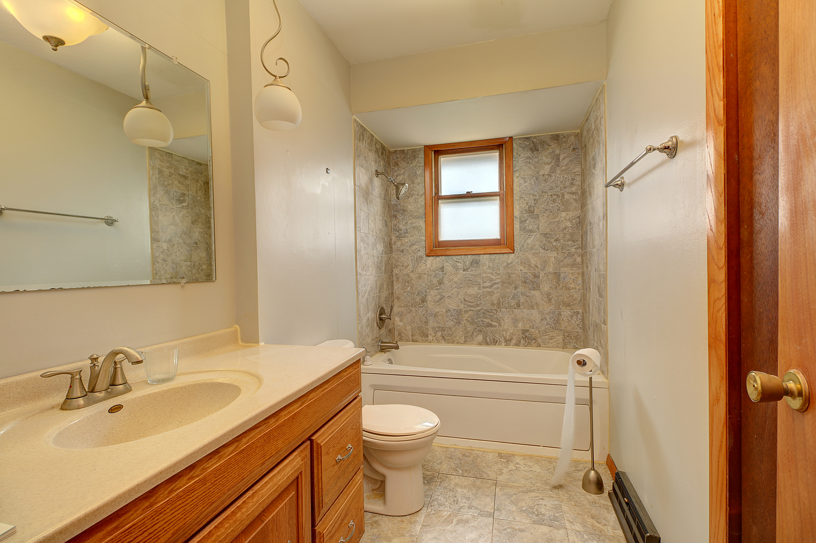 1356 Smith Road Lockport, IL 60441 - Photo 12 of 20 a bathroom with a sink a toilet and shower