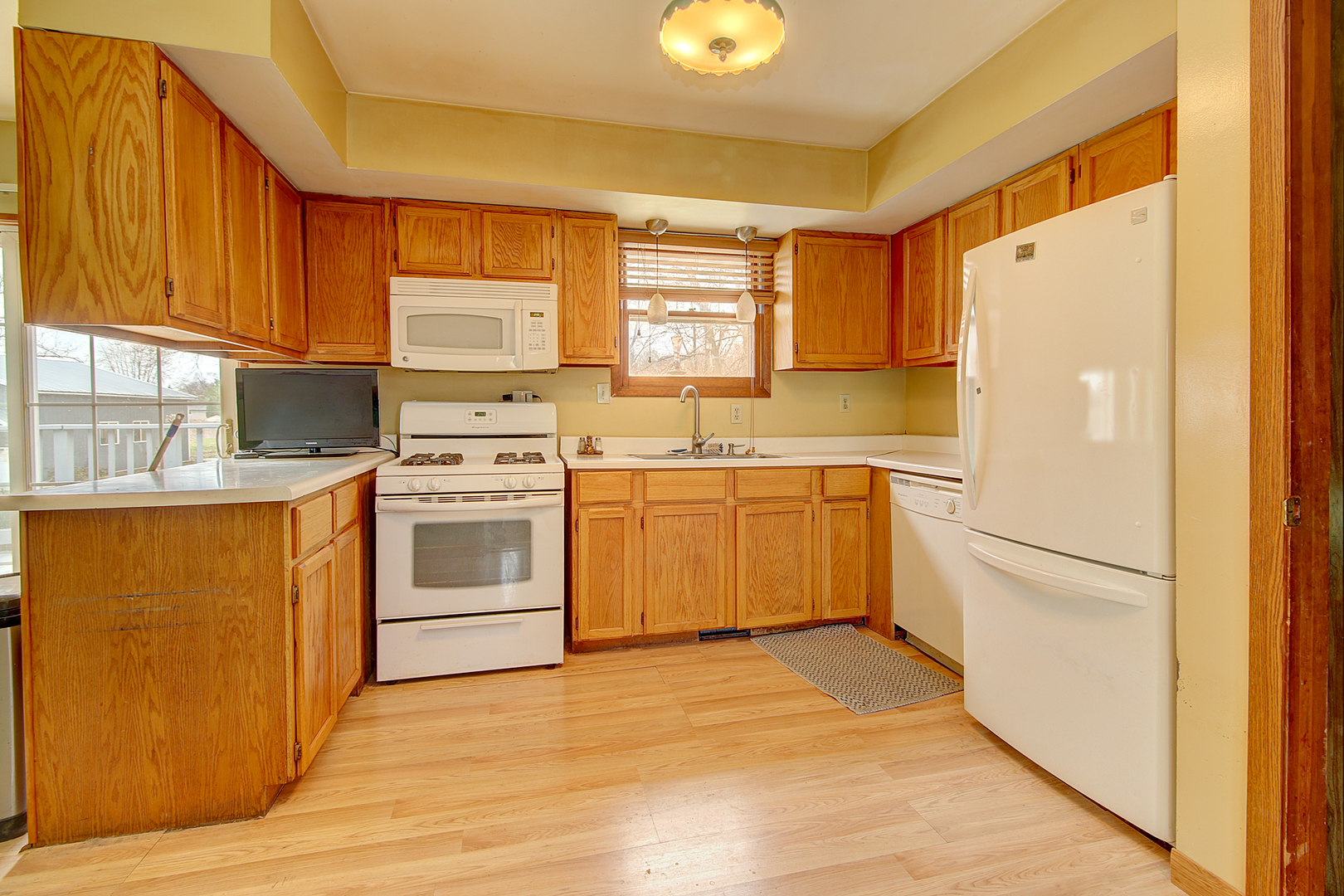 1356 Smith Road Lockport, IL 60441 - Photo 6 of 20 a kitchen with a stove top oven sink and cabinets