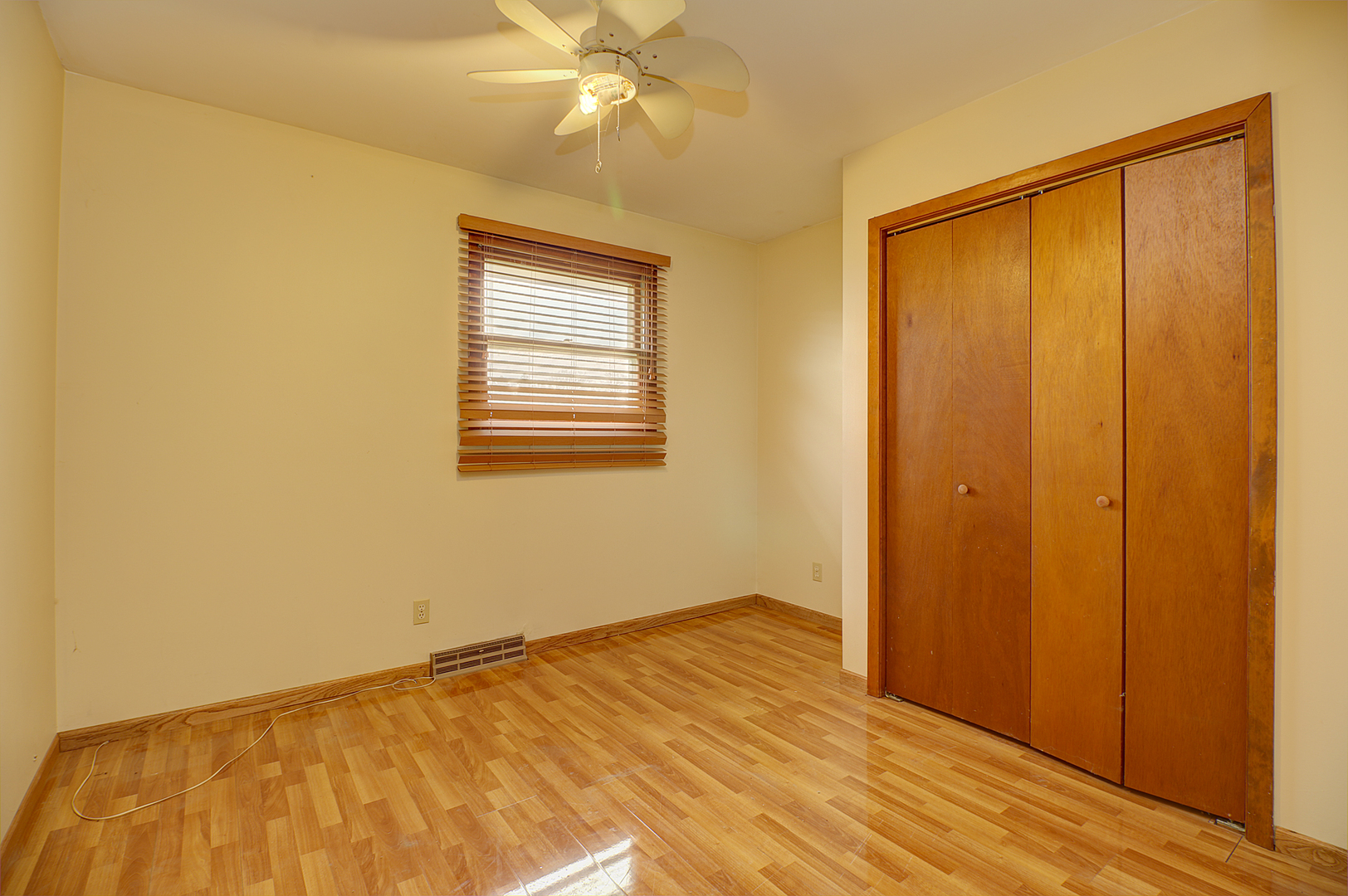 1356 Smith Road Lockport, IL 60441 - Photo 9 of 20 a view of an empty room with wooden floor and a window