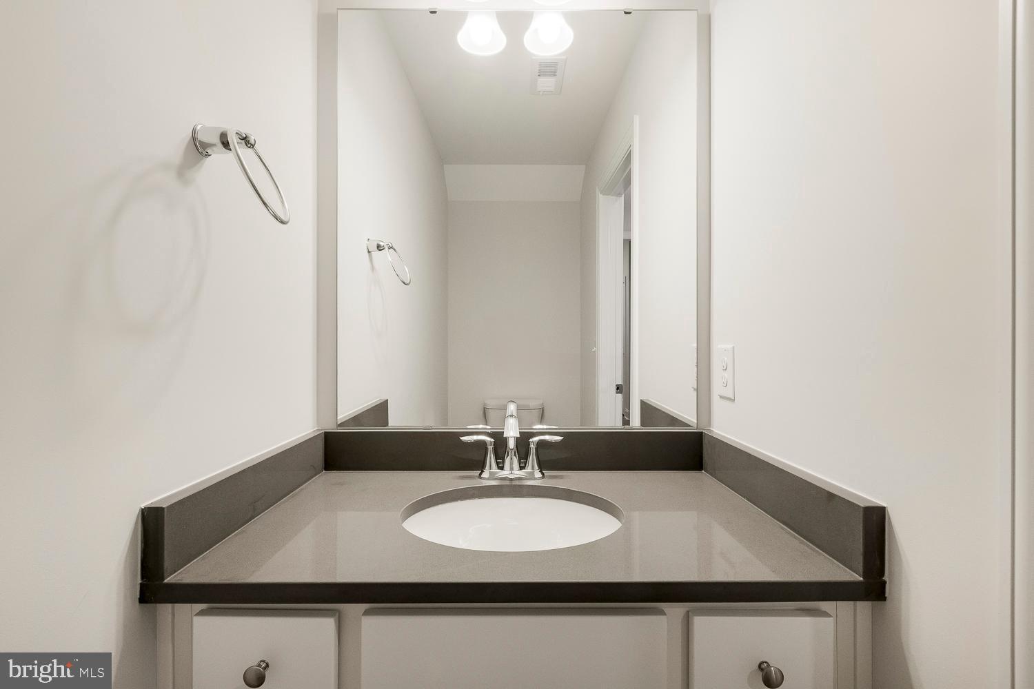 3186 Three Chopt Road Gum Spring, VA 23065 - Photo 6 of 11 a bathroom with a sink and a mirror