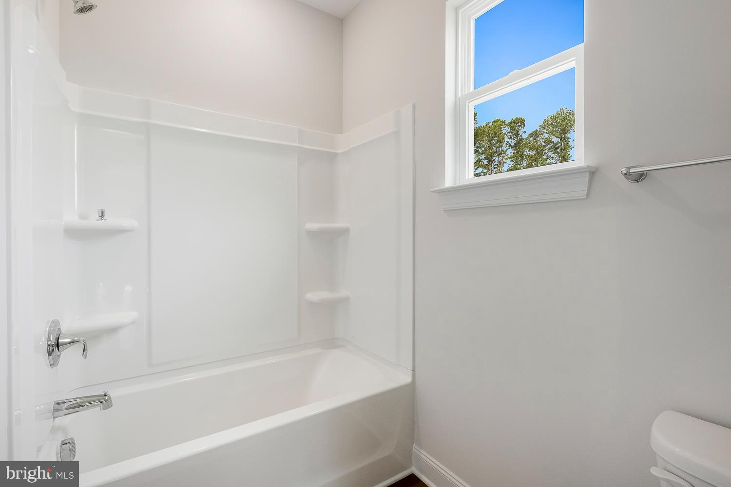 3186 Three Chopt Road Gum Spring, VA 23065 - Photo 10 of 11 a white bath tub sitting next to a white toilet