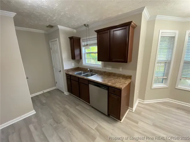 a kitchen with stainless steel appliances granite countertop a stove and a refrigerator