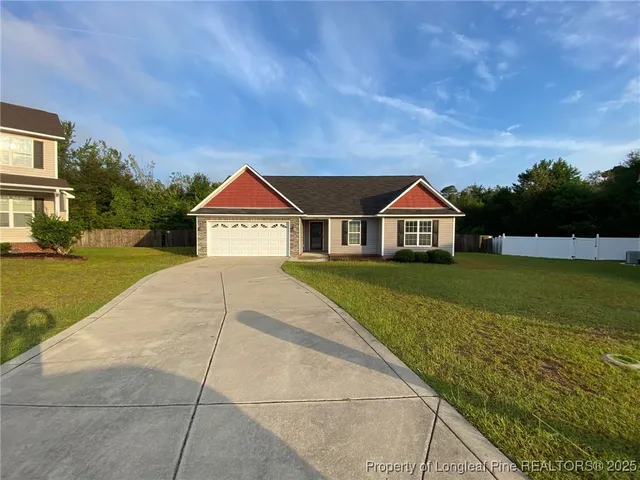 a view of house with yard