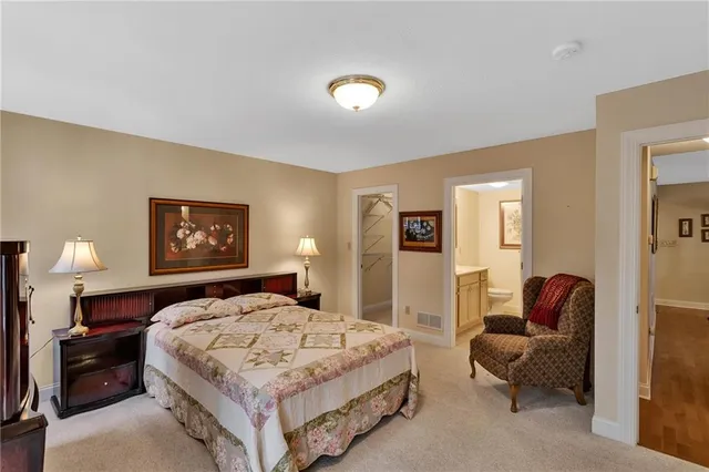 a bedroom with a bed and a couch