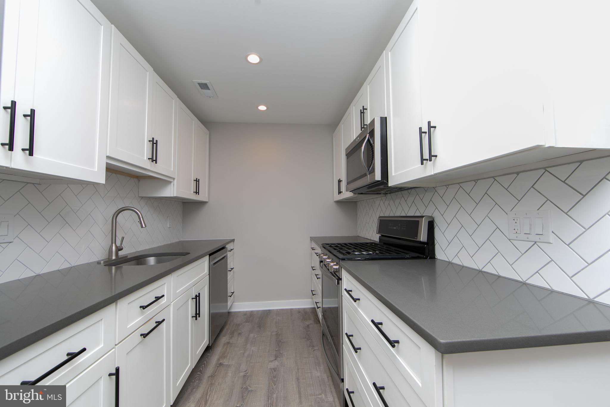 306 Tavistock Road Cherry Hill, NJ 08034 - Photo 13 of 33 Renovated kitchen with stainless steel appliances