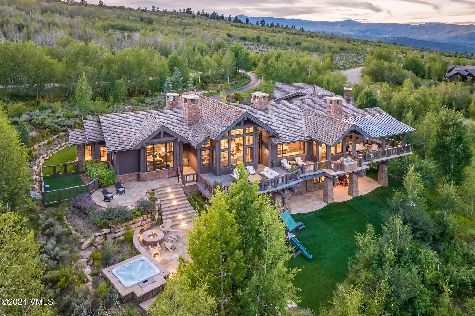 an aerial view of a house with garden space and street view