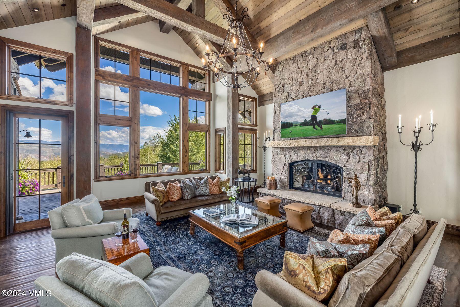 76 Setting Sun Lane Wolcott, CO 81655 - Photo 15 of 79 a living room with furniture fireplace and a large window