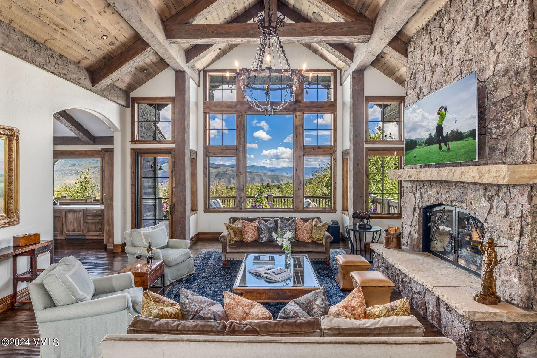 76 Setting Sun Lane Wolcott, CO 81655 - Photo 16 of 79 a living room with furniture a fireplace and a flat screen tv