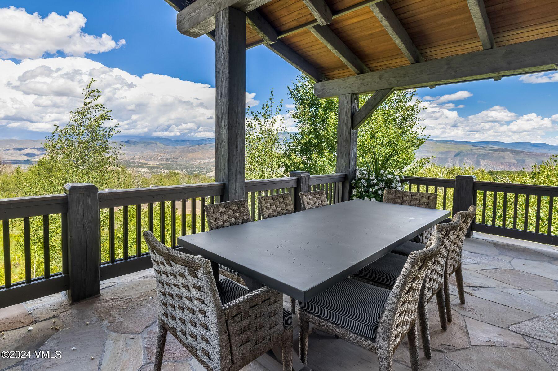 76 Setting Sun Lane Wolcott, CO 81655 - Photo 26 of 79 a view of a patio with a table chairs and backyard
