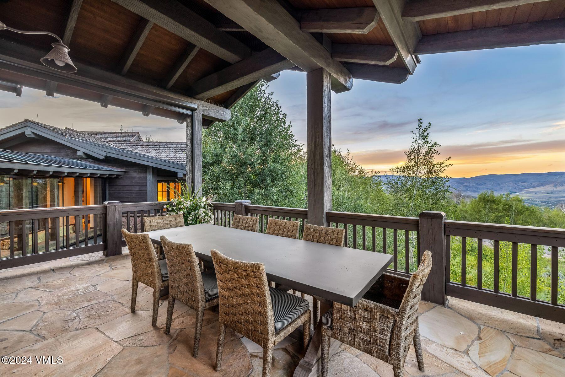 76 Setting Sun Lane Wolcott, CO 81655 - Photo 27 of 79 a view of a patio with a table chairs and a backyard