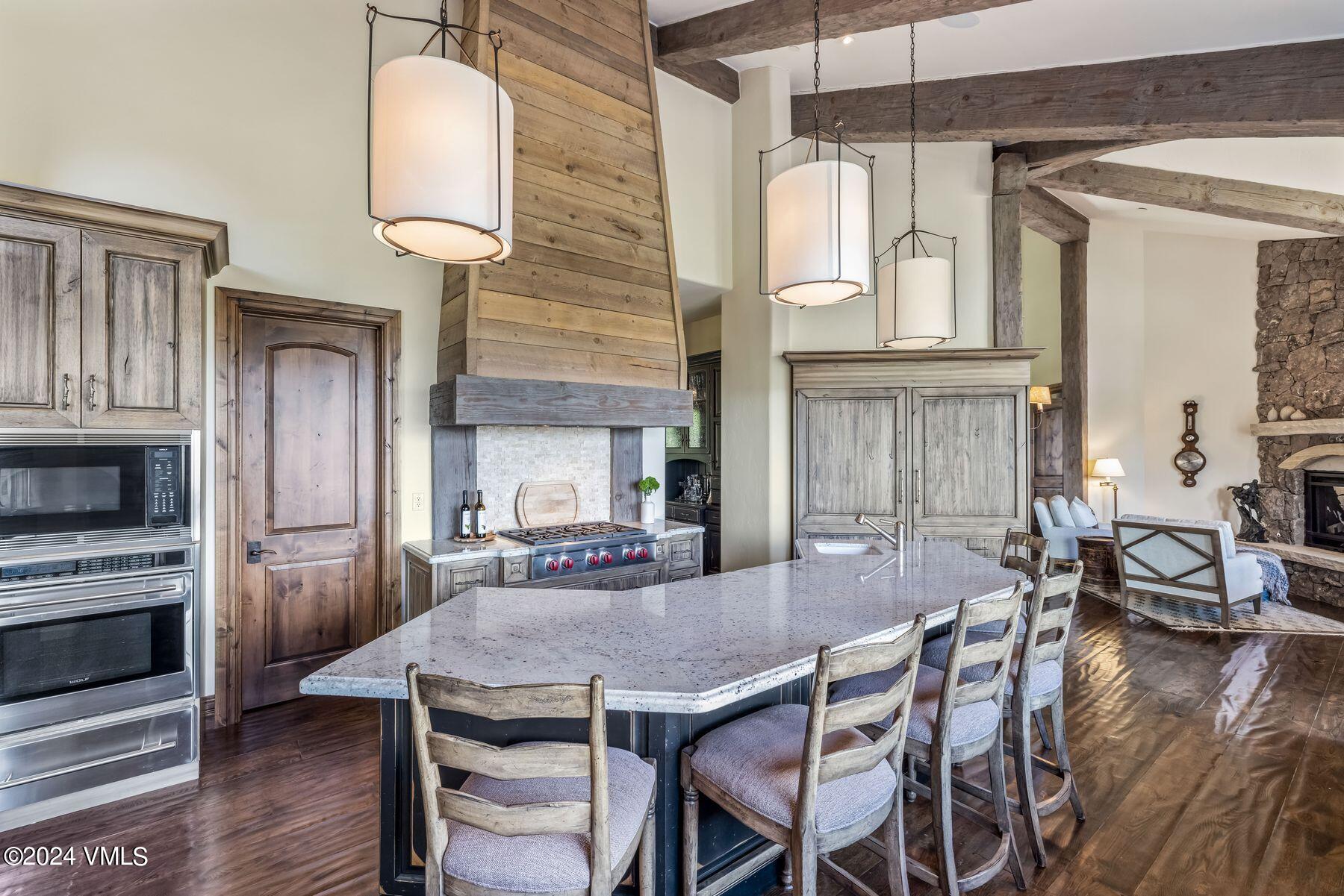 76 Setting Sun Lane Wolcott, CO 81655 - Photo 30 of 79 a view of a dining room with furniture and wooden floor