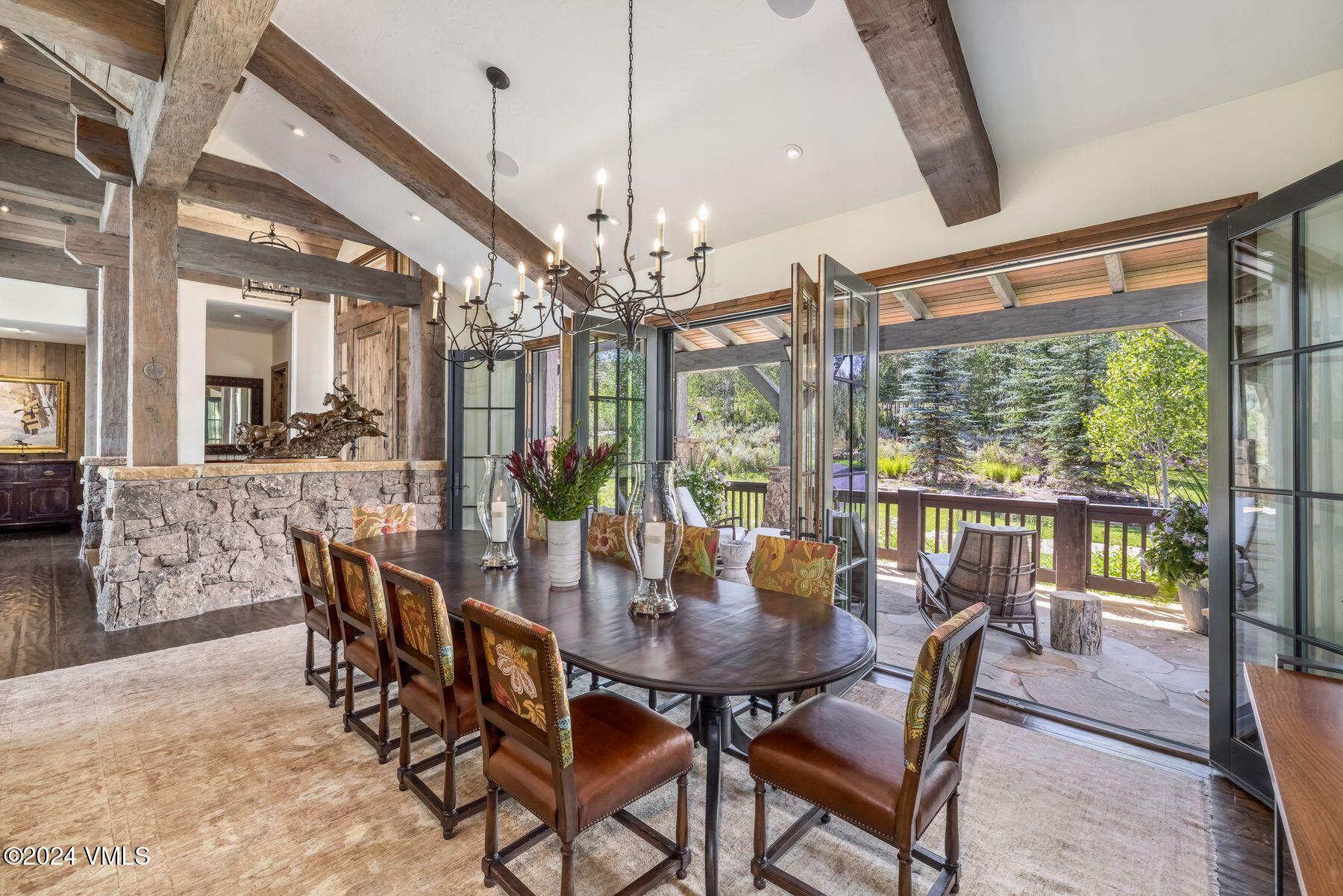 76 Setting Sun Lane Wolcott, CO 81655 - Photo 36 of 79 a view of a dining room with furniture window and wooden floor