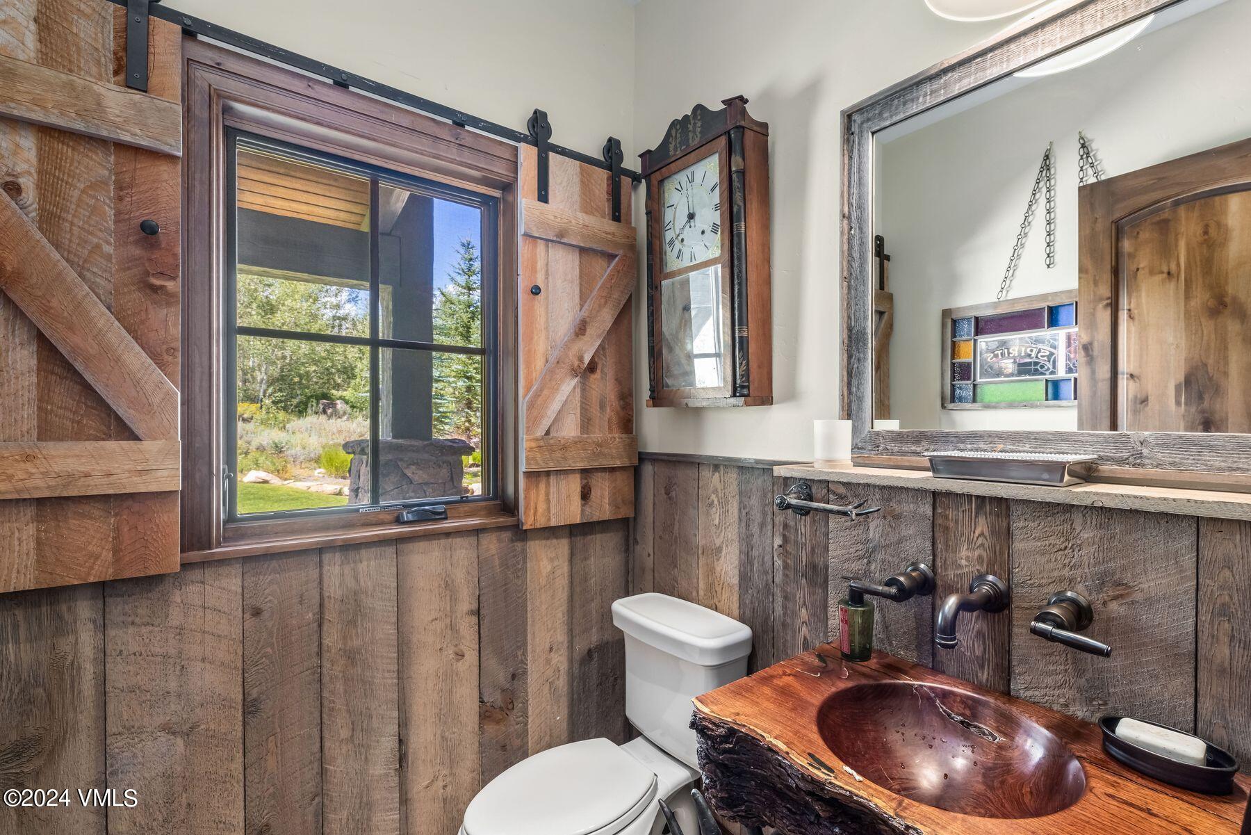 76 Setting Sun Lane Wolcott, CO 81655 - Photo 39 of 79 a bathroom with a sink a toilet and a mirror