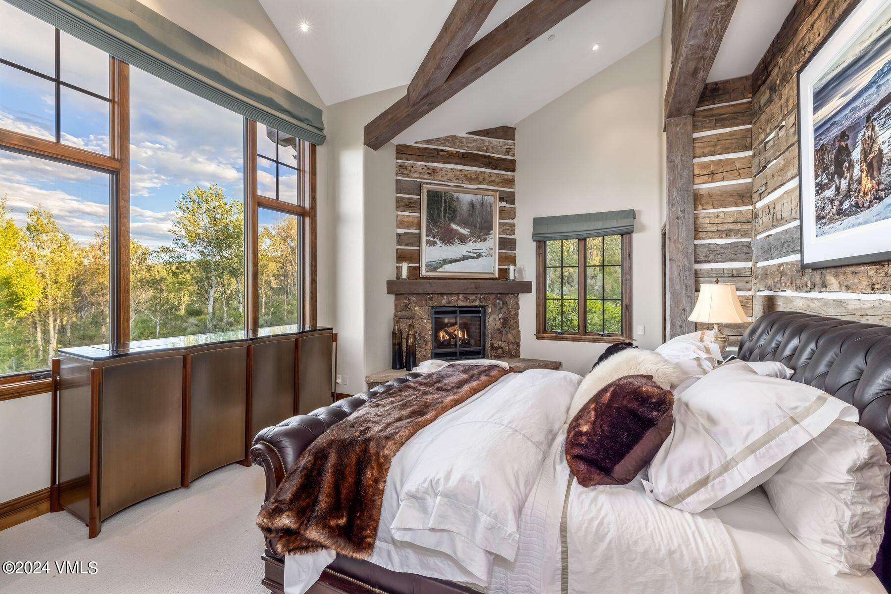 76 Setting Sun Lane Wolcott, CO 81655 - Photo 40 of 79 a bed sitting in a bedroom next to a large window