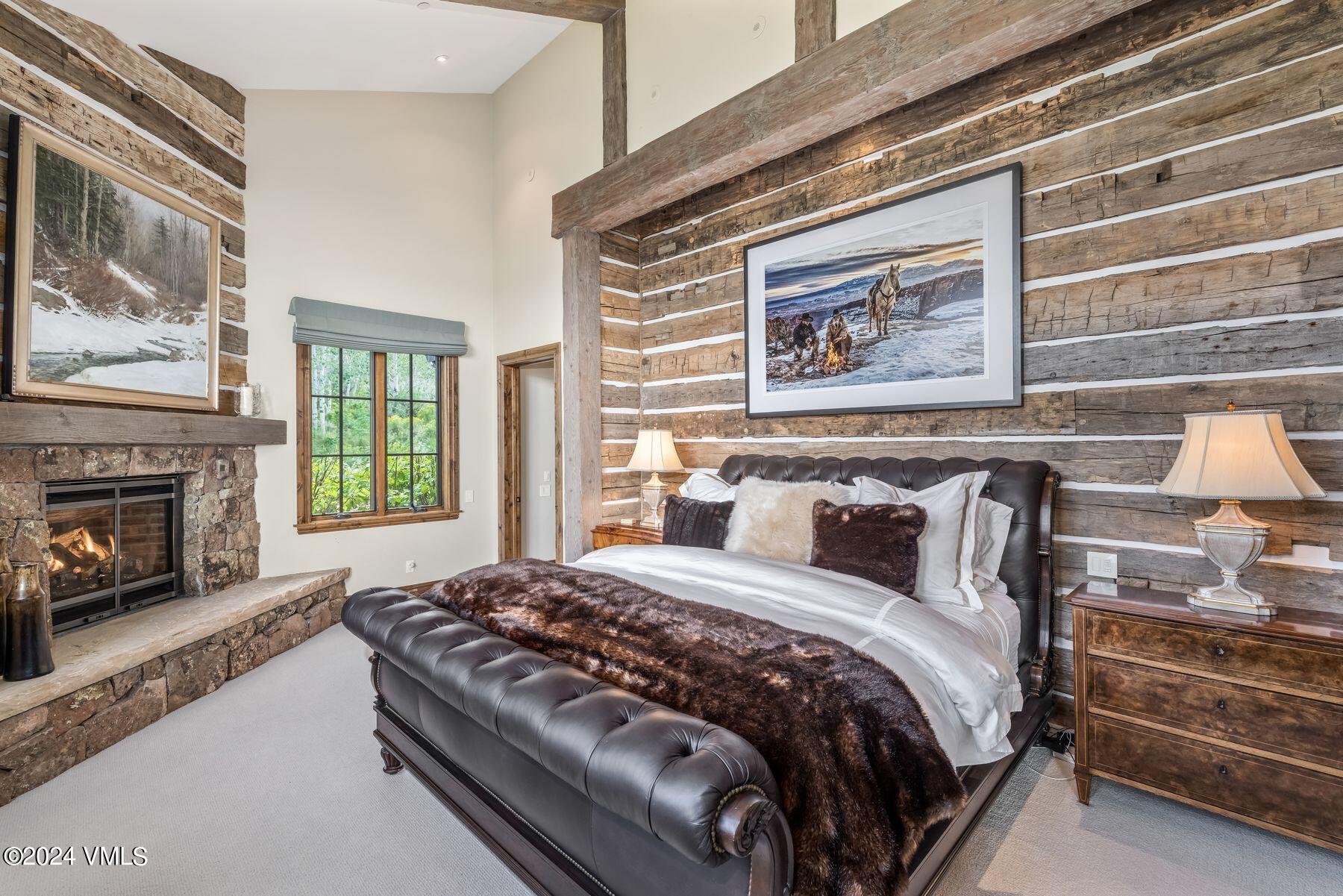 76 Setting Sun Lane Wolcott, CO 81655 - Photo 41 of 79 a bedroom with a bed and a fireplace