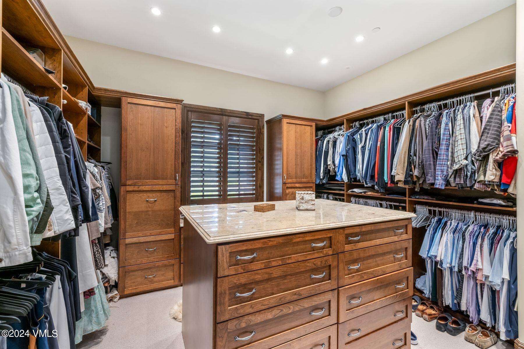 76 Setting Sun Lane Wolcott, CO 81655 - Photo 44 of 79 a view of walk in closet with clothes and shoes