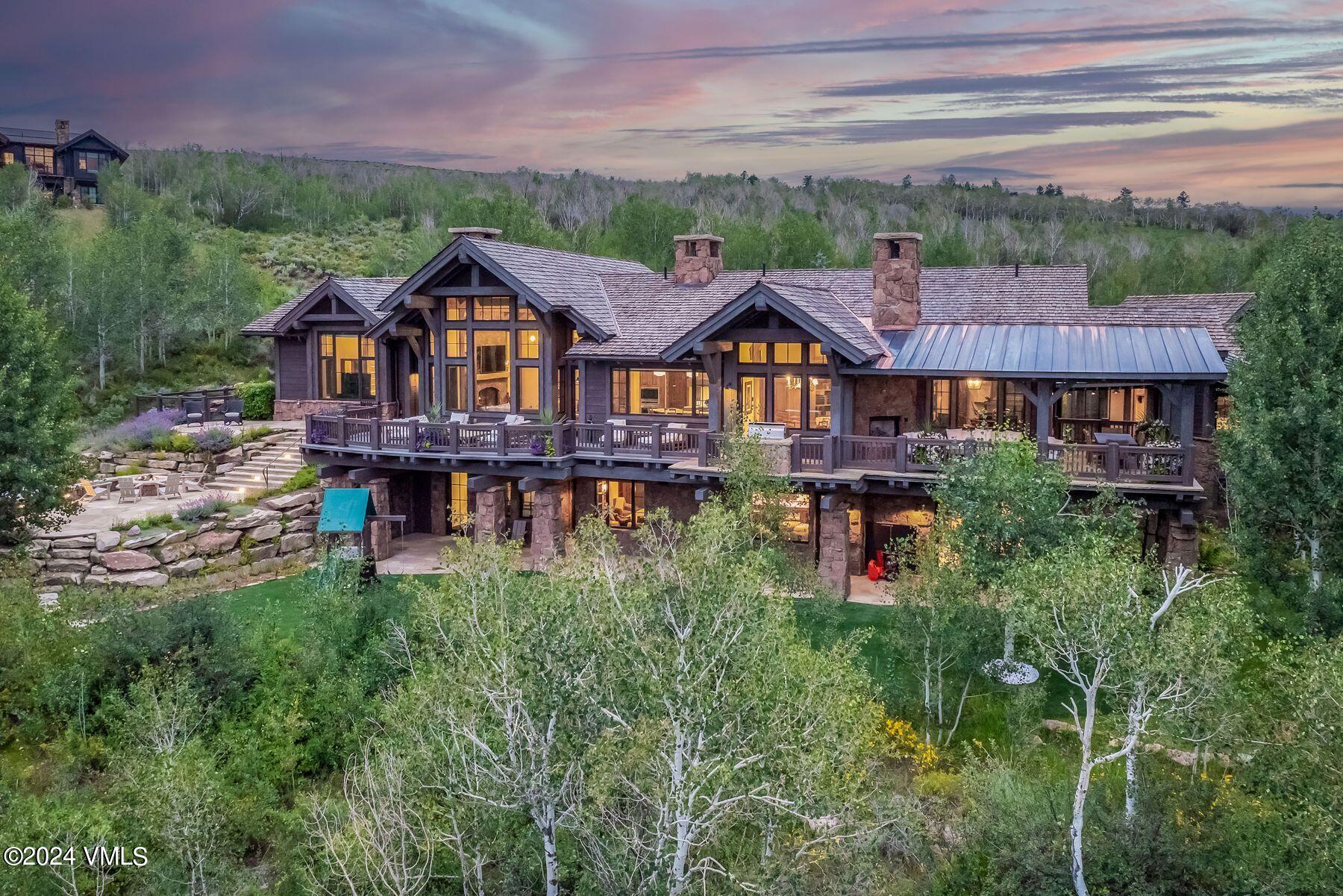 76 Setting Sun Lane Wolcott, CO 81655 - Photo 5 of 79 a front view of a house with a yard and potted plants