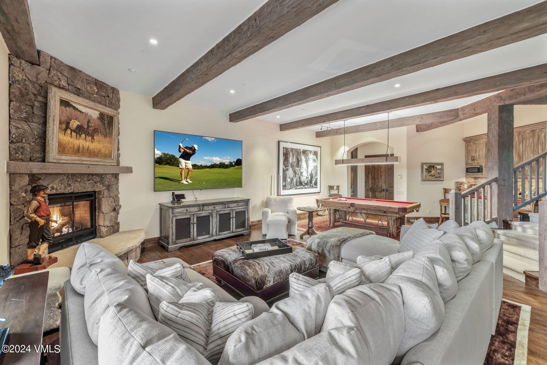 76 Setting Sun Lane Wolcott, CO 81655 - Photo 52 of 79 a living room with furniture flat screen tv and a fireplace