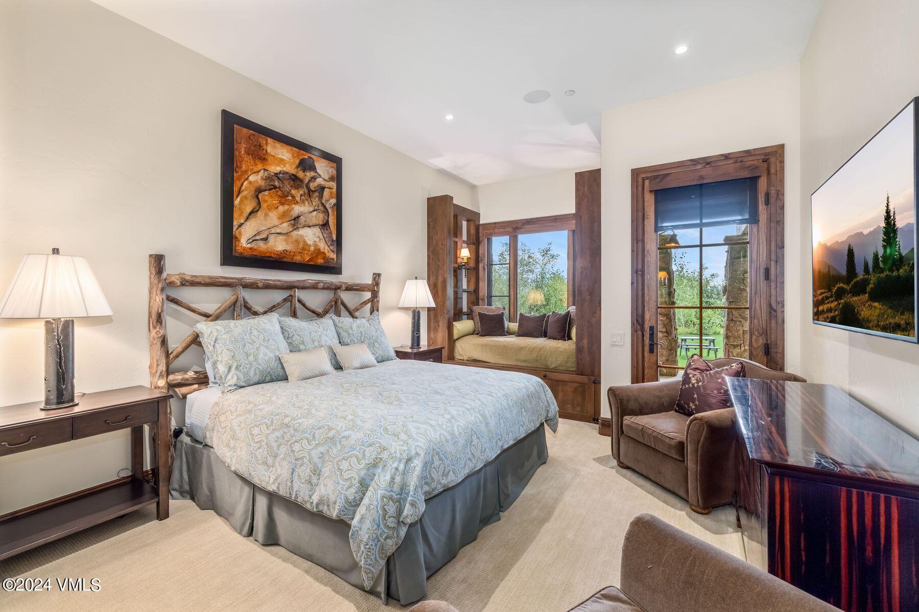 76 Setting Sun Lane Wolcott, CO 81655 - Photo 56 of 79 a bedroom with a large bed couch and a window