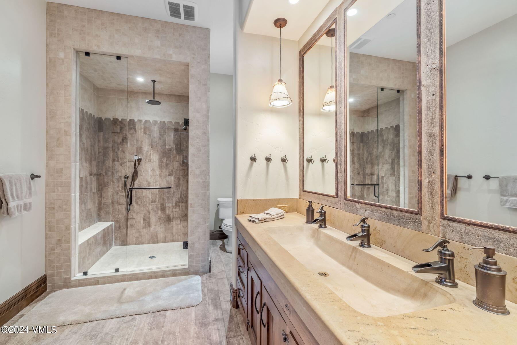 76 Setting Sun Lane Wolcott, CO 81655 - Photo 58 of 79 a bathroom with a sink double vanity and a shower