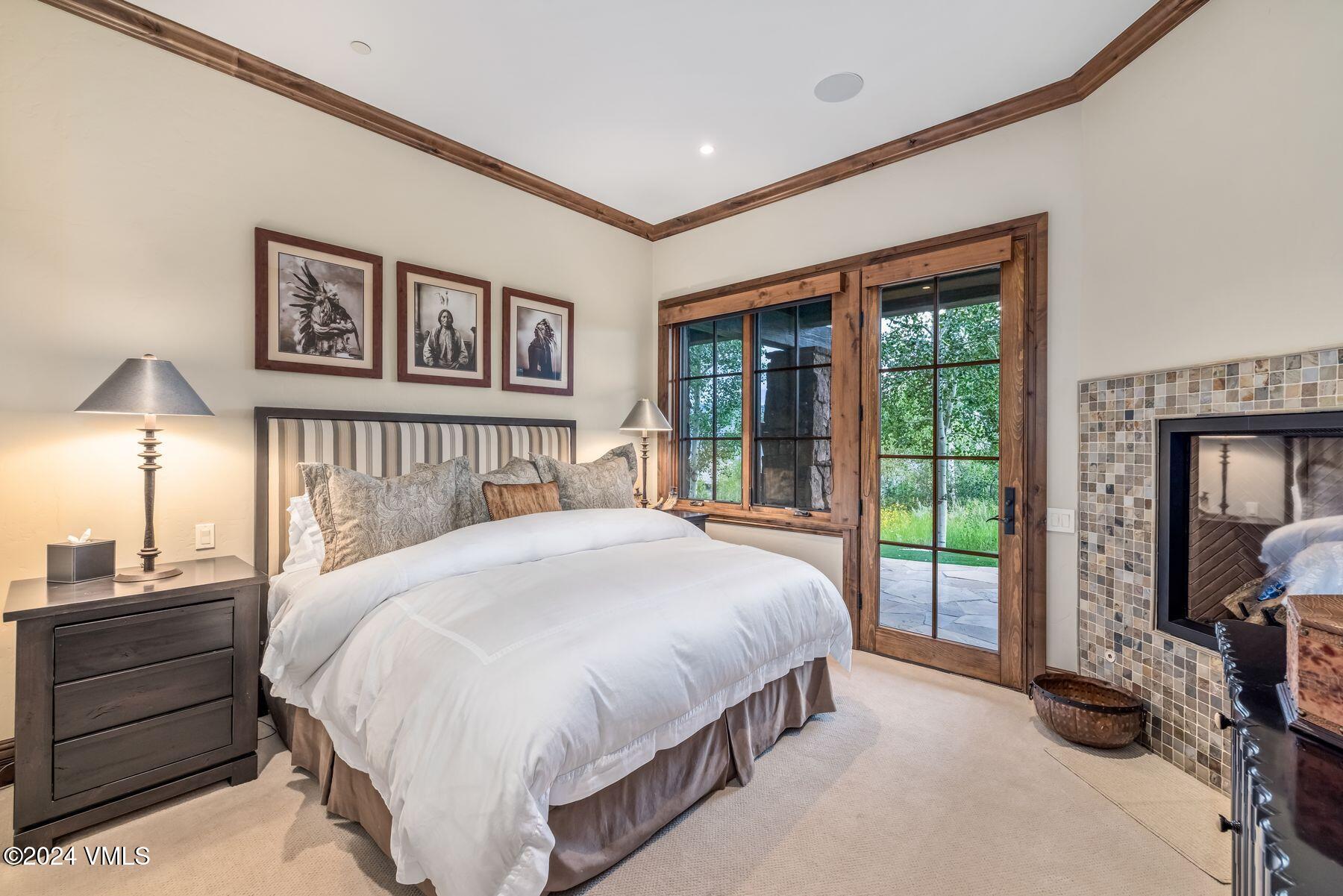 76 Setting Sun Lane Wolcott, CO 81655 - Photo 59 of 79 a spacious bedroom with a bed and a large window