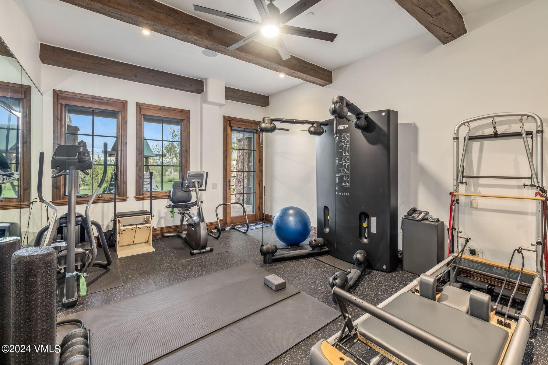 76 Setting Sun Lane Wolcott, CO 81655 - Photo 62 of 79 a room with gym equipment and large windows