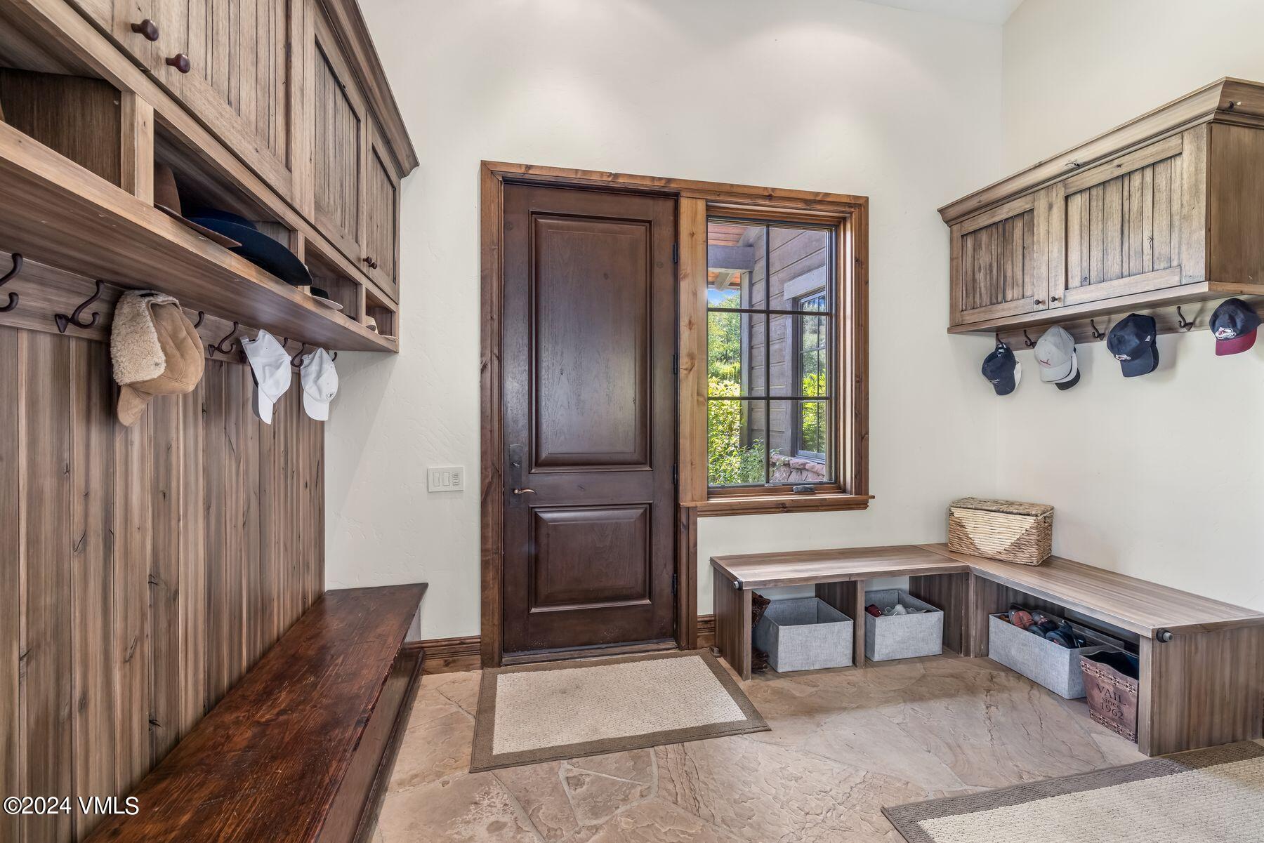 76 Setting Sun Lane Wolcott, CO 81655 - Photo 64 of 79 a view of an entryway with wooden floor and windows