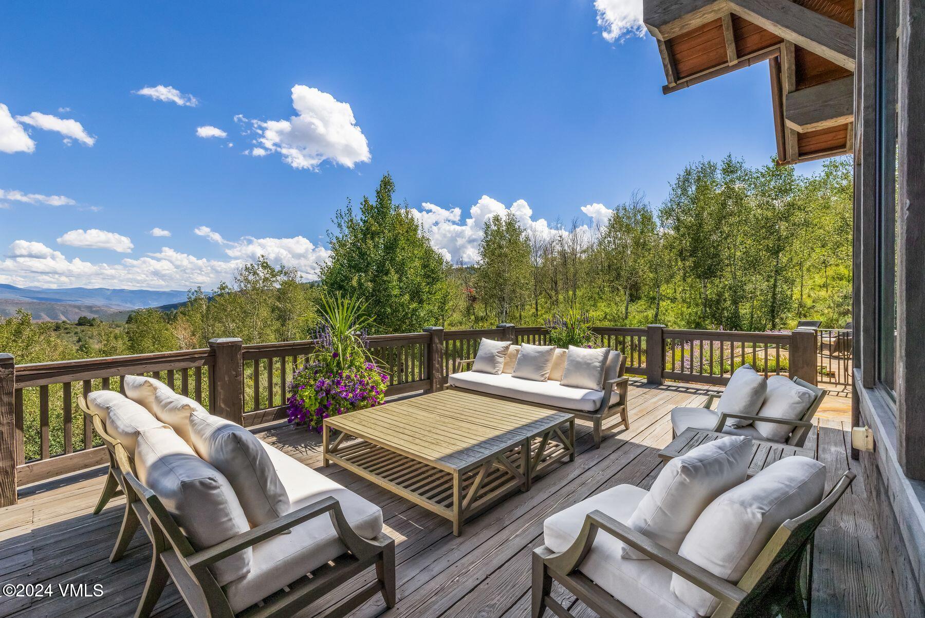 76 Setting Sun Lane Wolcott, CO 81655 - Photo 77 of 79 a view of a balcony with wooden floor and outdoor seating