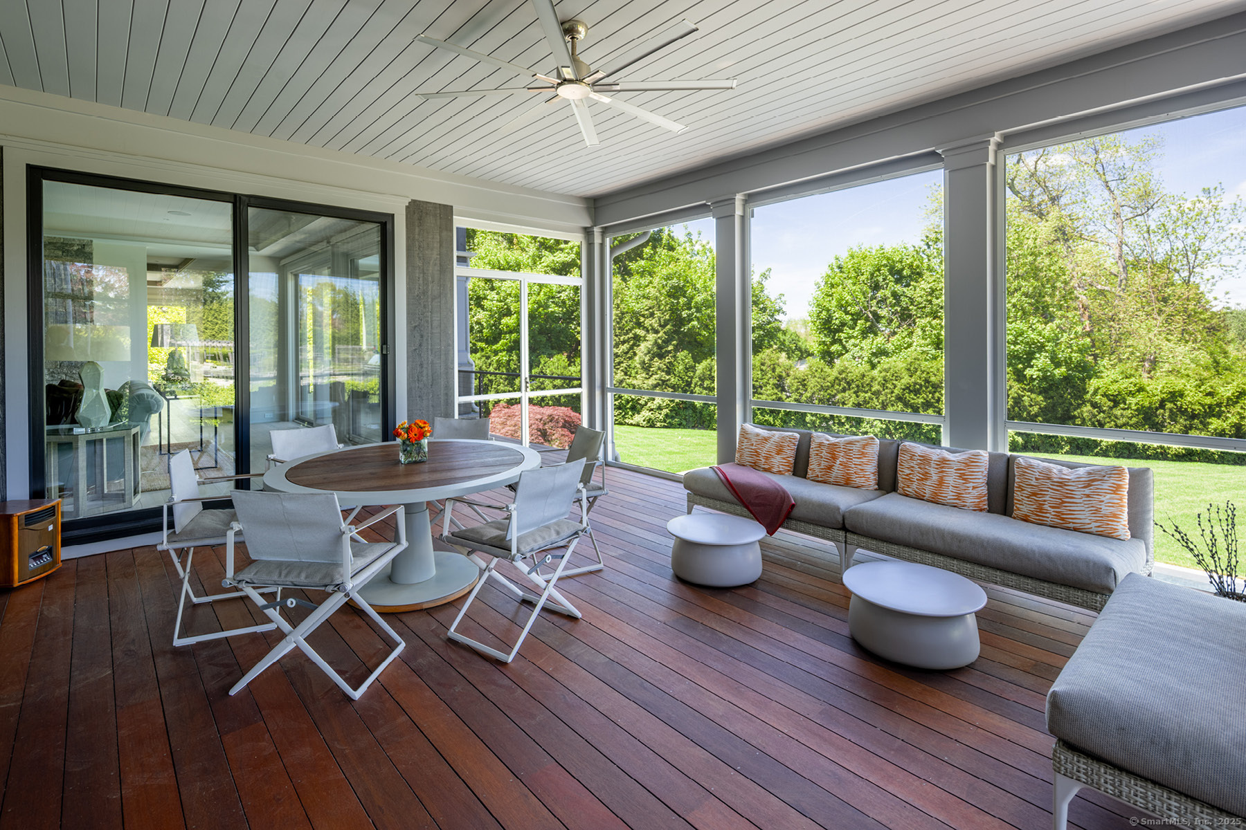 39 Compo Parkway Westport, CT 06880 - Photo 12 of 40 a dining room with wooden floor and a floor to ceiling window