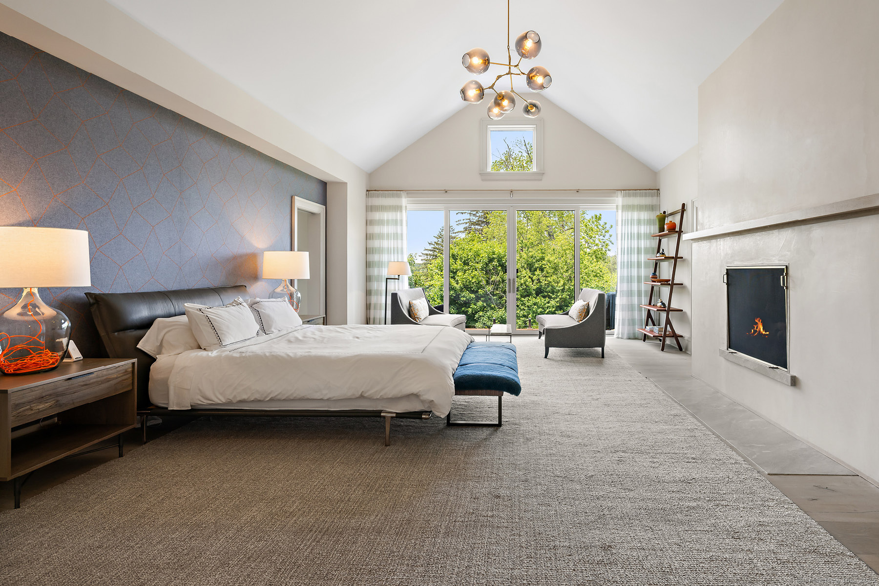 39 Compo Parkway Westport, CT 06880 - Photo 18 of 40 a spacious bedroom with a bed and a chandelier