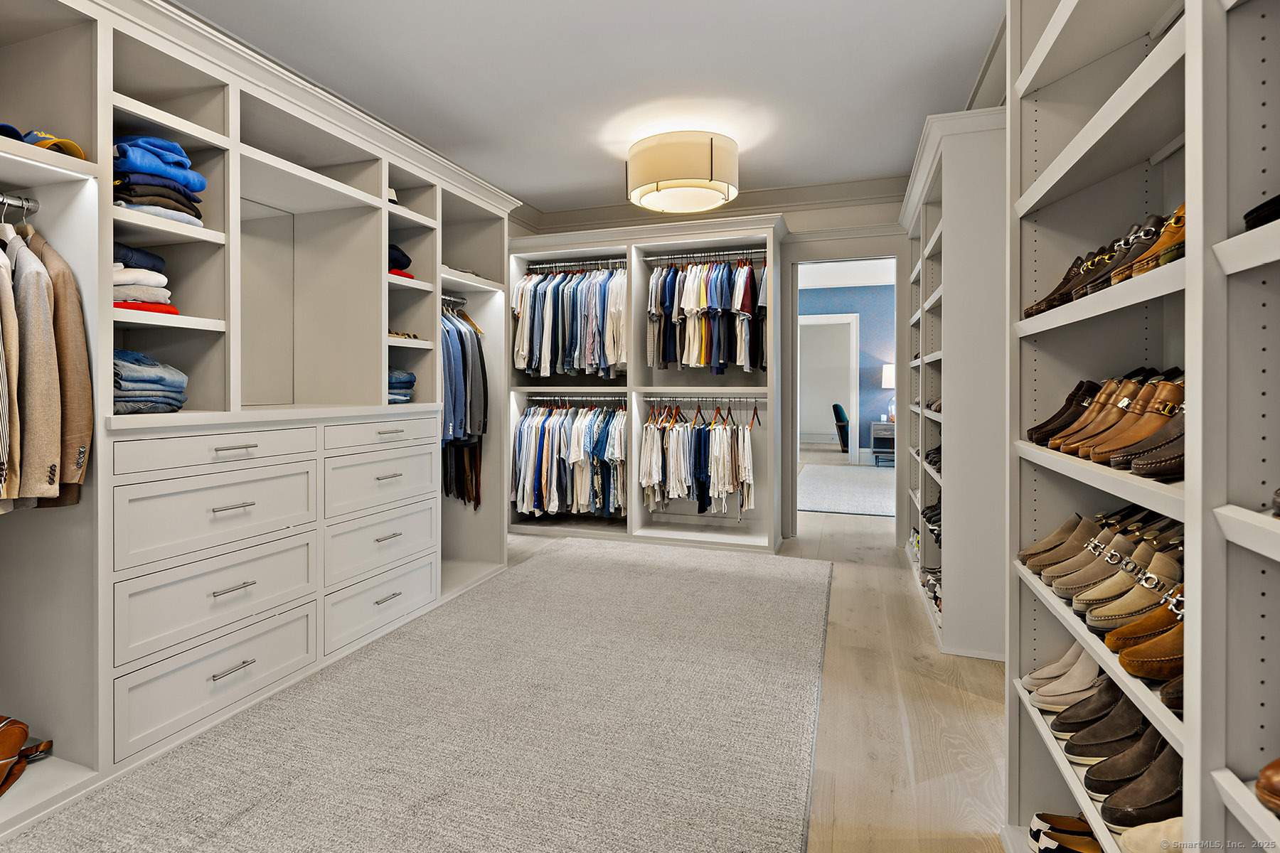 39 Compo Parkway Westport, CT 06880 - Photo 23 of 40 walk in closet with clothes and shoes