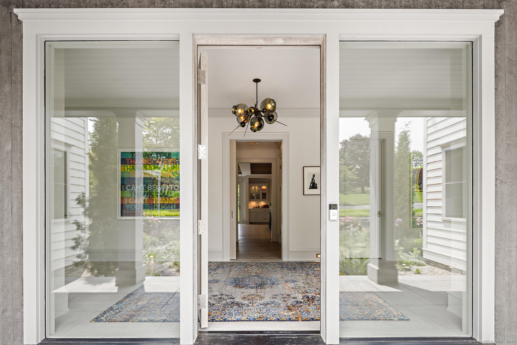 39 Compo Parkway Westport, CT 06880 - Photo 3 of 40 a front view of a bathroom with a glass shower door and a glass door