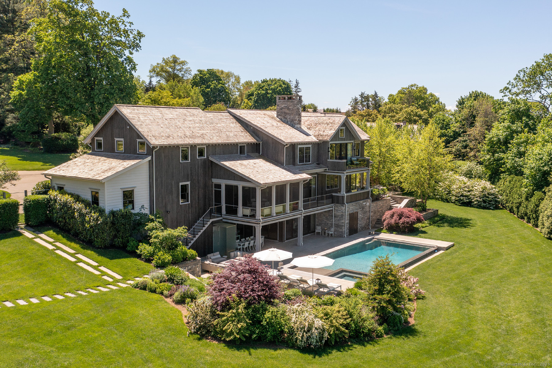 39 Compo Parkway Westport, CT 06880 - Photo 39 of 40 a aerial view of a house with a yard table and chairs