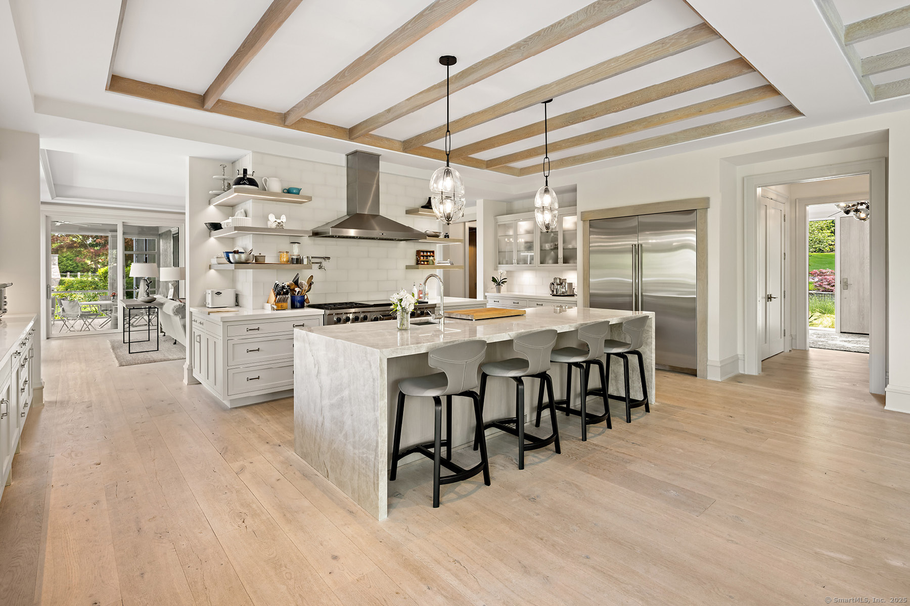 39 Compo Parkway Westport, CT 06880 - Photo 8 of 40 a kitchen with stainless steel appliances a dining table chairs stove and cabinets