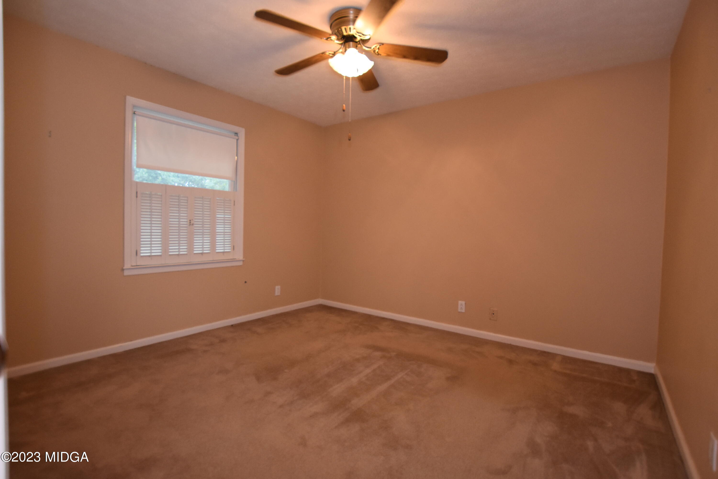 2994 Rolling Road Macon, GA 31204 - Photo 17 of 27 an empty room with windows and fan