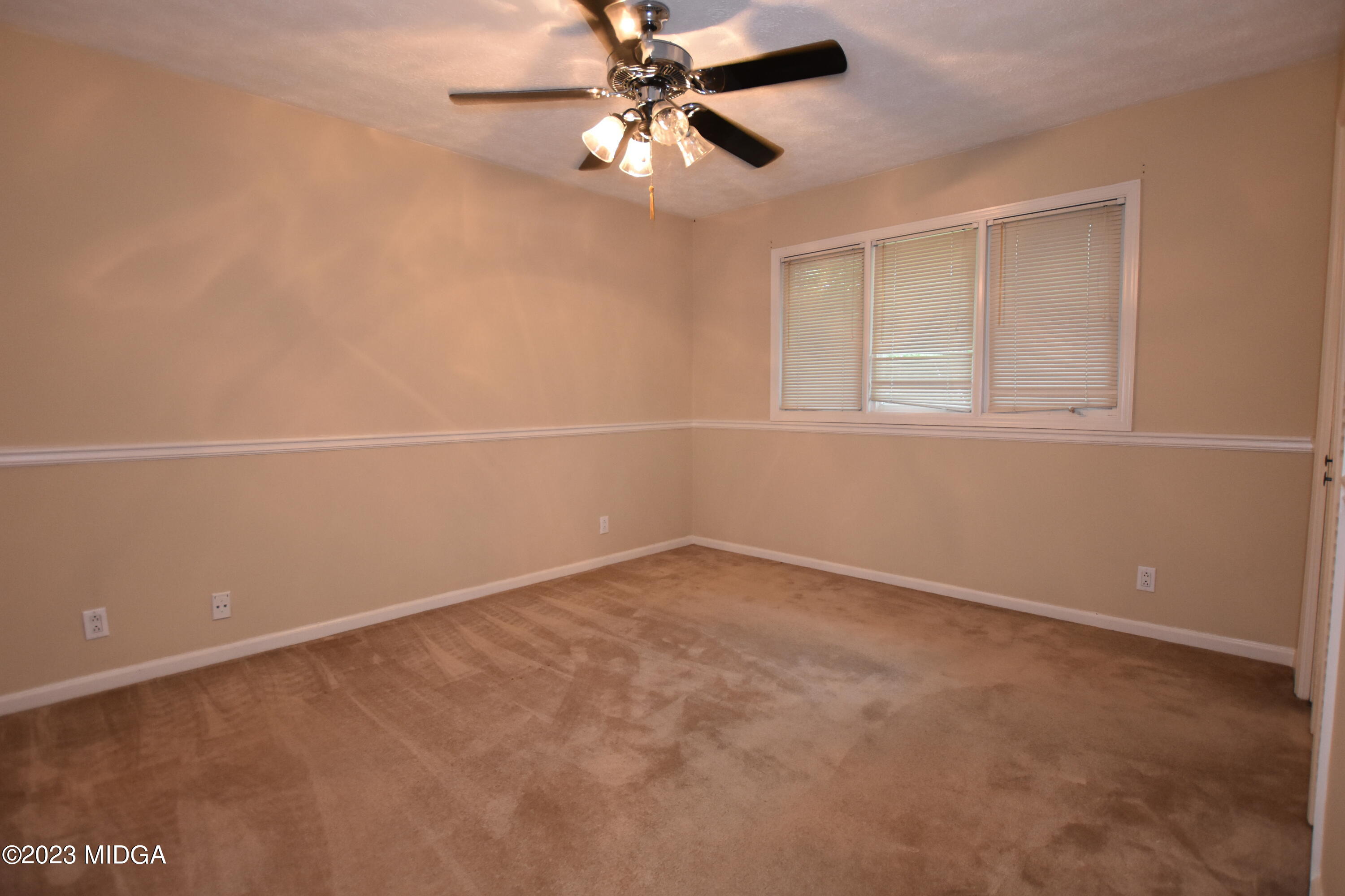 2994 Rolling Road Macon, GA 31204 - Photo 18 of 27 an empty room with a window and a fan